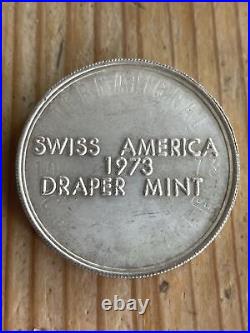 1973 1oz. 999 Fine Silver Swiss America Draper Mint Round Over Struck Design