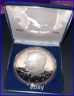 1995 8 Ounce Silver Pure. 999 Fine Bullion John F. Kennedy Round, some toning