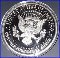 1995 8 Ounce Silver Pure. 999 Fine Bullion John F. Kennedy Round, some toning