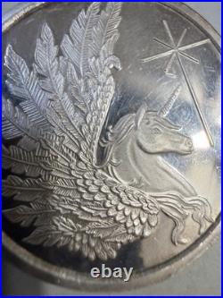T10135-1 oz Argentia Pegacorn Silver Round. 999 Fine Silver High Relief Medal